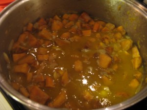 add chicken broth and continue to simmer